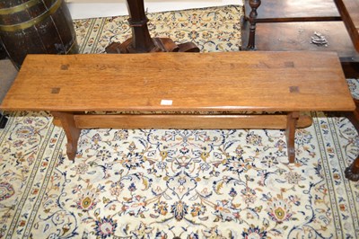 Lot 597 - An oak Arts & Crafts style low bench of plain...