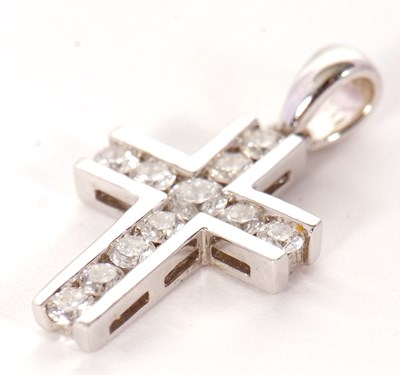 Lot 50 - An 18ct diamond cross pendant, the cross set...