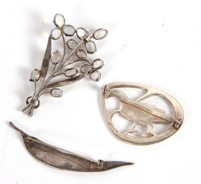 Lot 112 - Three brooches, to include an silver pigeon...