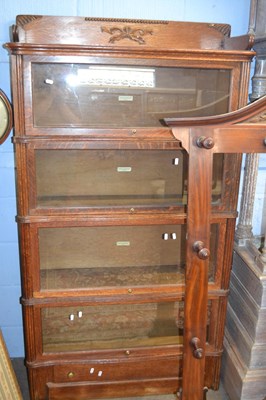 Lot 648 - A Globe Wernicke oak four tier stacking...