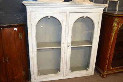 Lot 655 - A cream painted Victorian glazed cupboard with...