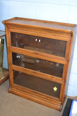 Lot 663 - A Globe Wernicke oak three tier stacking...