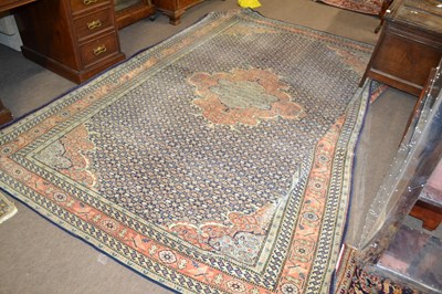 Lot 595 - An early 20th Century Persian wool carpet with...