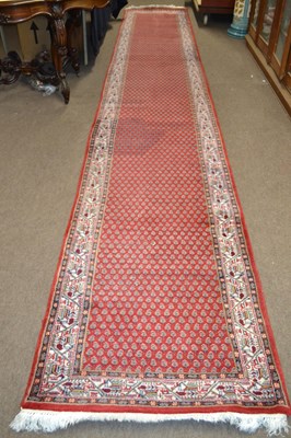 Lot 680 - An Iranian wool runner carpet decorated with a...