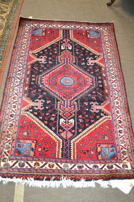 Lot 682 - A modern Persian wool rug decorated with large...