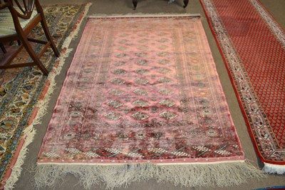 Lot 685 - A 20th Century silk mix Bokhara type floor rug,...