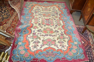 Lot 686 - An early 20th Century wool rug decorated with...