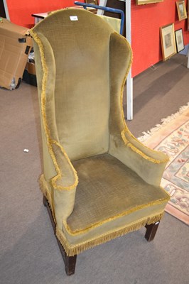 Lot 434 - A narrow Georgian style wing back armchair,...