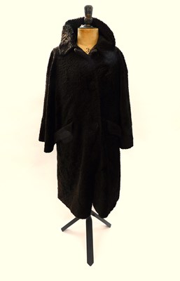 Lot 84 - A mid 20th century brown astrakhan fur coat,...