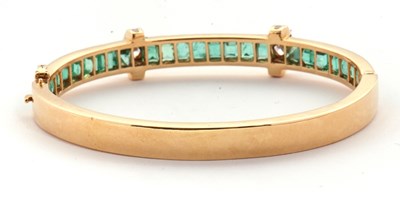 Lot 361 - An emerald and diamond bangle, the upper half...