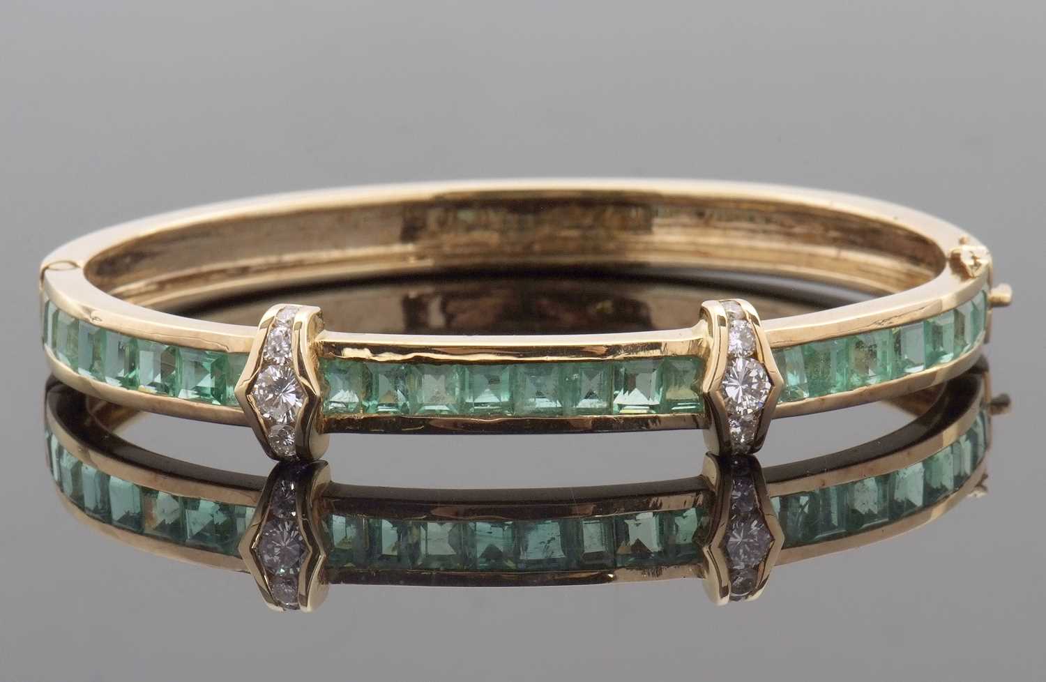 Lot 361 - An emerald and diamond bangle, the upper half...