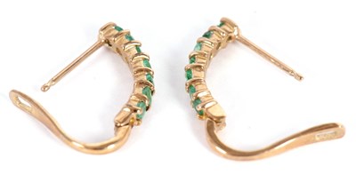 Lot 70 - A pair of 9k emerald earrings, the half hoops...