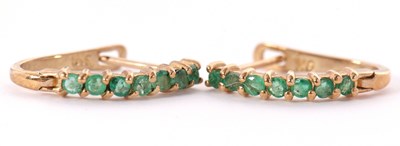 Lot 70 - A pair of 9k emerald earrings, the half hoops...