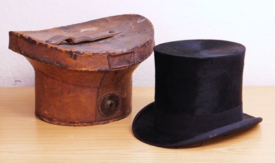 Lot 185a - A top hat and leather case, the top hat by...
