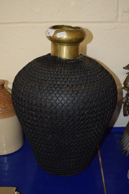 Lot 13 - A contemporary mesh mounted brass vase