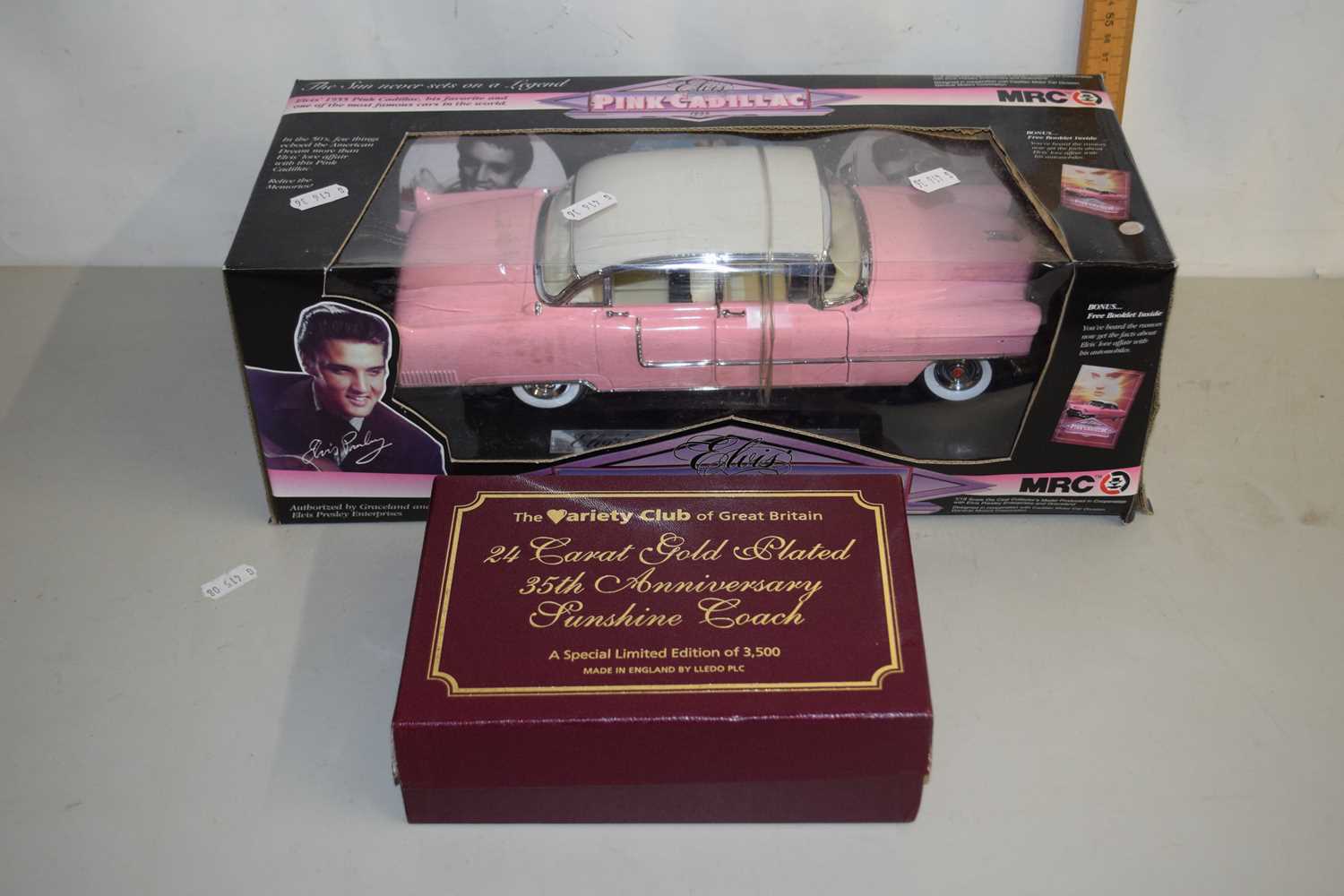 Lot 23 - An Elvis Presley pink cadillac model together...