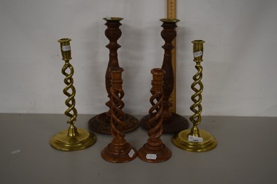 Lot 180 - A pair of barley twist brass candlesticks plus...