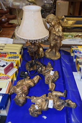 Lot 210 - Group of various cherub models and a table lamp