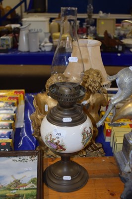 Lot 229 - A ceramic based oil lamp