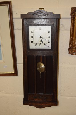 Lot 276 - Early 20th Century oak cased wall clock