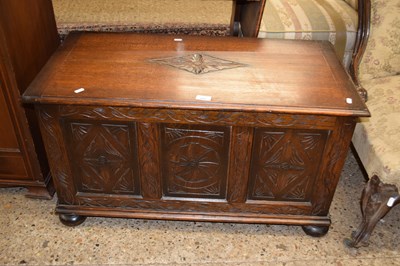 Lot 299 - An oak blanket box with carved decoration