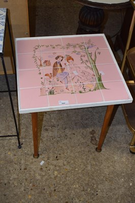 Lot 337 - A wood framed tile top table decorated with a...