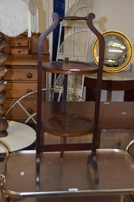 Lot 338 - A mahogany two tier cake stand