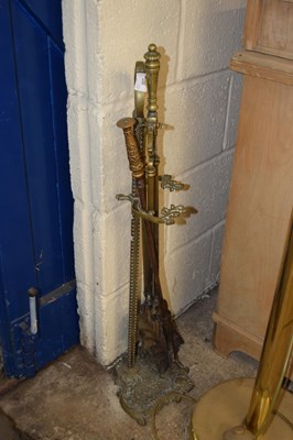 Lot 357 - Set of brass fire tools and stand