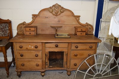 Lot 363 - A large Victorian pine sideboard with arched back