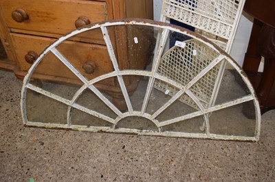 Lot 365 - A semi circle iron framed window, 114cm wide