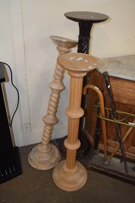 Lot 734 - A group of three turned wooden plant stands