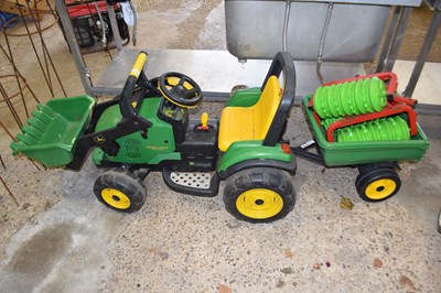 Lot 1049 - A child's ride on tractor with trailer,...