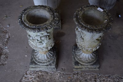 Lot 1094 - Two composite garden urns/planters