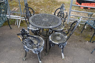 Lot 1115 - Cast metal garden dining set to include a...