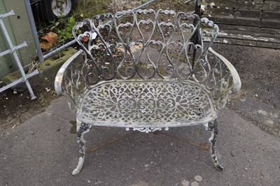 Lot 1118 - A decorative cast garden bench