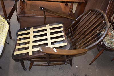 Lot 794 - An Ercol chair frame and accompanying footstool