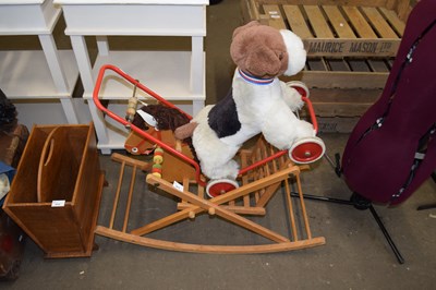 Lot 813 - Push along toy dog and a child's rocking horse...