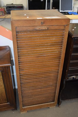 Lot 818 - A tambour front cabinet