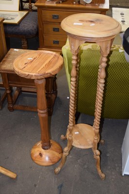 Lot 851 - Two pine jardiniere stands