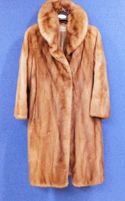 Lot 90 - A lady's three quarter length fur coat by...