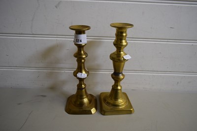 Lot 574 - TWO BRASS CANDLESTICKS