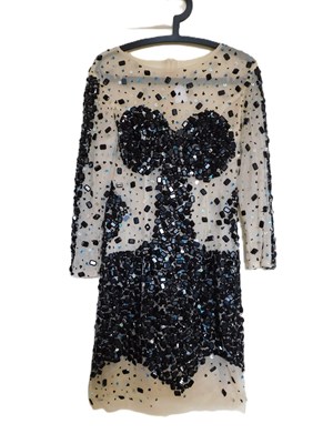 Lot 49 - A black and cream beaded cocktail dress, the...