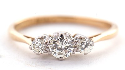Lot 19 - An 18ct three stone diamond ring, the three...