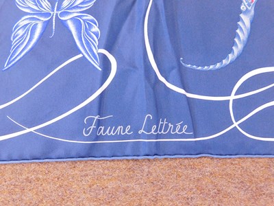 Lot 117 - An Hermes 'Faune Lettre' silk scarf designed...