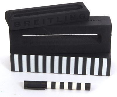 Lot 160 - A Breitling pen, the black and white ballpoint...