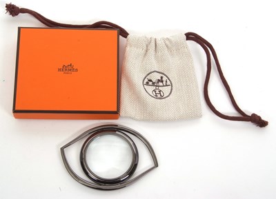 Lot 162 - An Hermes magnifier, the eye shaped metal...