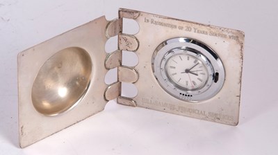 Lot 229 - A silver cased quartz clock with presentation...