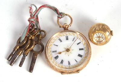 Lot 232 - A yellow metal pocket watch with chain fob...