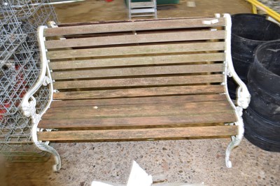 Lot 1064 - Garden bench with decorative cast iron ends