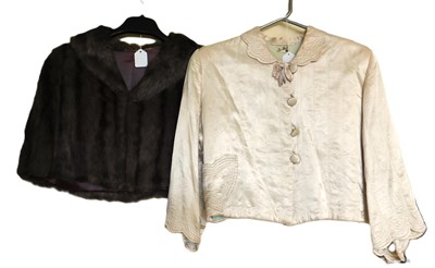 Lot 16 - A mid 20th century lady's satin cropped jacket,...